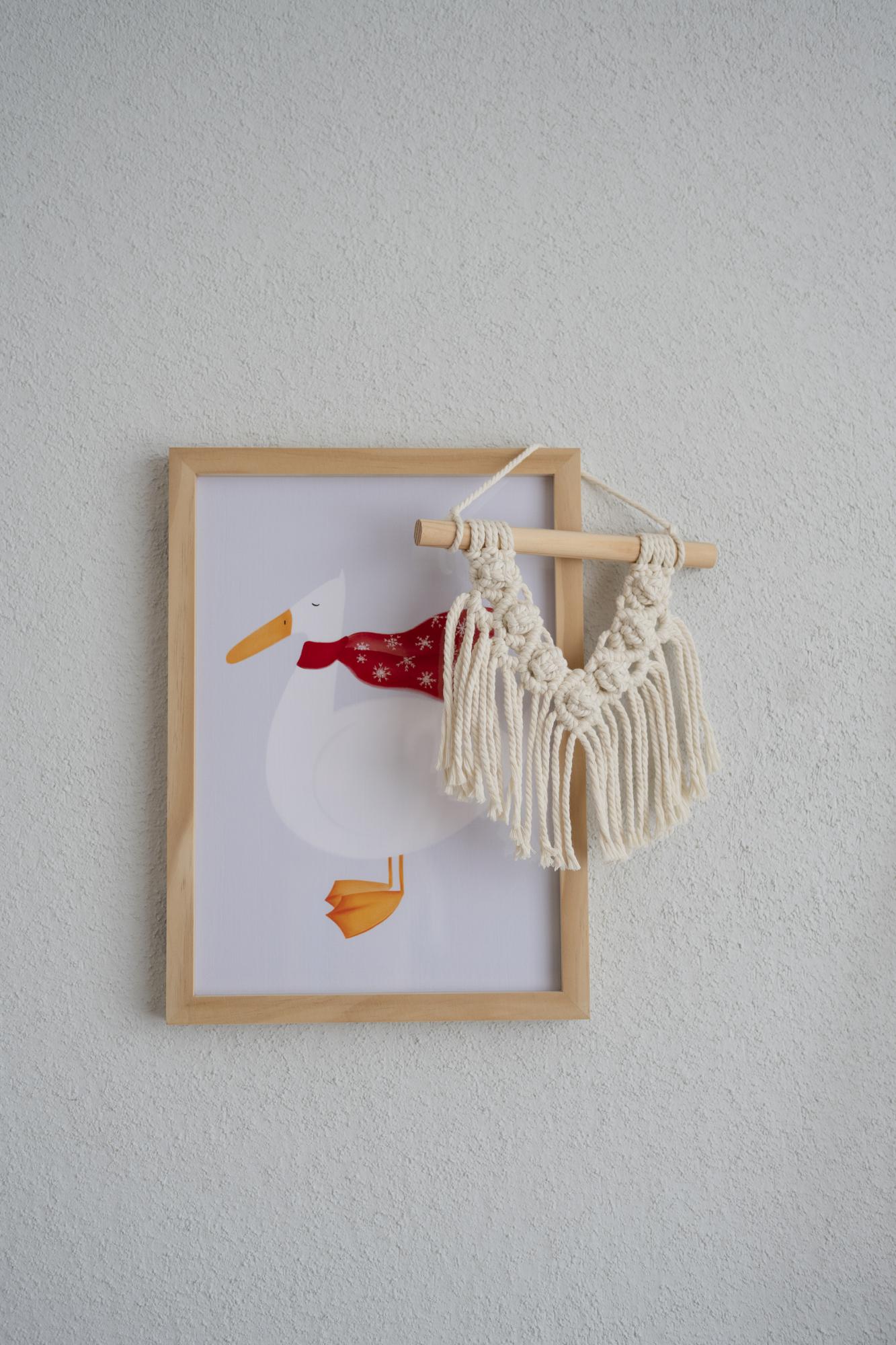 framed embroidered textile on gallery wall